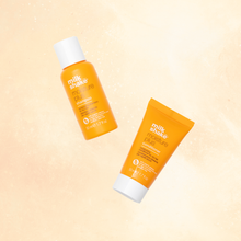 Load image into Gallery viewer, milk_shake moisture plus mini bottles with white caps on a gradient beige background