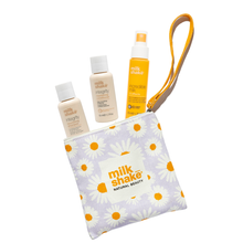 Load image into Gallery viewer, Set of milk_shake integrity shampoo, conditioner and incredible milk in a pouch with daisy pattern on a white background