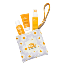 Load image into Gallery viewer, milk_shake moisture plus shampoo and conditioner with incredible milk with a daisy-patterned pouch on a white background