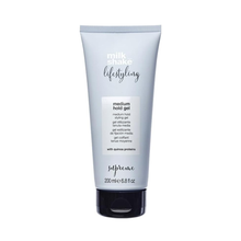 Load image into Gallery viewer, Tube of milk_shake styling gel on a white background