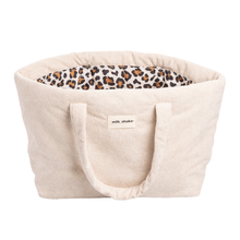 Load image into Gallery viewer, Beige beach bag with leopard print interior and 'milk_shake' label on a white background