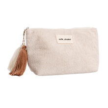 Load image into Gallery viewer, Beige pouch with a tassel and 'milk_shake' label on a white background