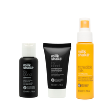 Load image into Gallery viewer, Three bottles of milk shake hair care products on a white background icy blond, incredible milk
