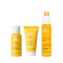 Load image into Gallery viewer, Three bottles of milk shake hair care products on a white background make my day and incredible milk
