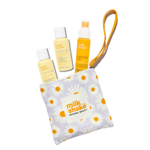 Load image into Gallery viewer, Set of 'milk shake' beauty products including bottles and a pouch on a white background
