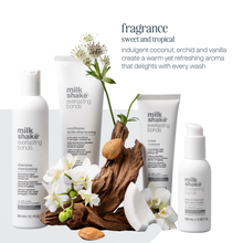 Load image into Gallery viewer, milk_shake everlasting bonds hair care products with flowers and driftwood on a white background
