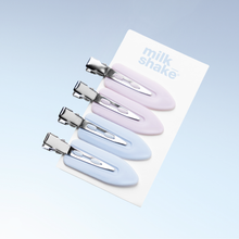 Load image into Gallery viewer, Set of four pastel-coloured hair clips on a 'milk shake' branded card against a light blue background.
