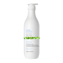 Load image into Gallery viewer, White bottle of 'milk shake no frizz allowed' conditioner on a white background
