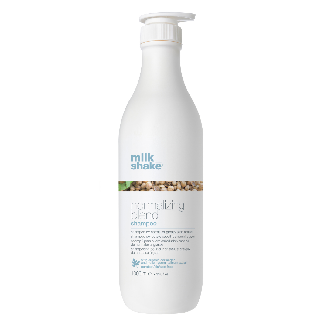 White shampoo bottle with 'milk_shake' normalizing blend on a white background