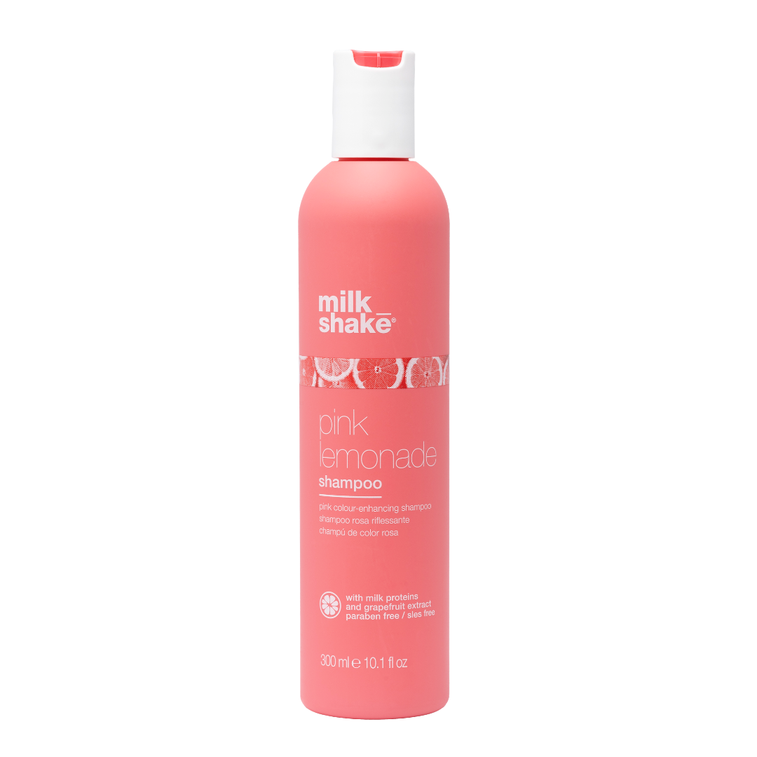 Pink shampoo bottle labeled 'milk_shake pink lemonade' on a white background