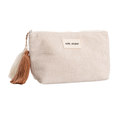 Beige pouch with a tassel and 'milk_shake' label on a white background