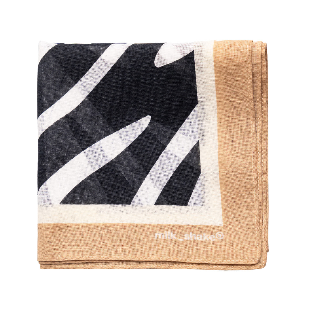 bandana with black, white, and beige design on a white background with milk_shake logo