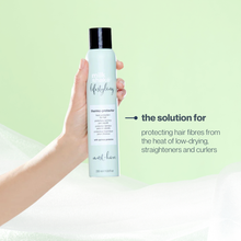 Load image into Gallery viewer, Hand holding a bottle of milk_shake  thermo-protector with text on a green background
